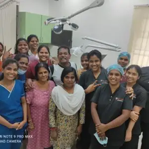 "Smiling patient with doctor and medical team in clinic"