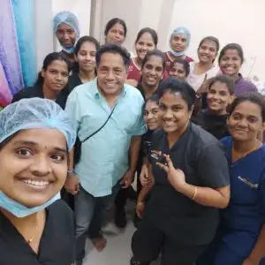 Satisfied patient posing with doctor and clinic crew