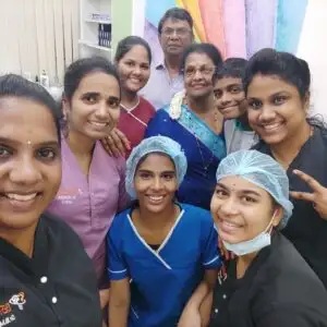 Patient and medical team smiling after successful treatment